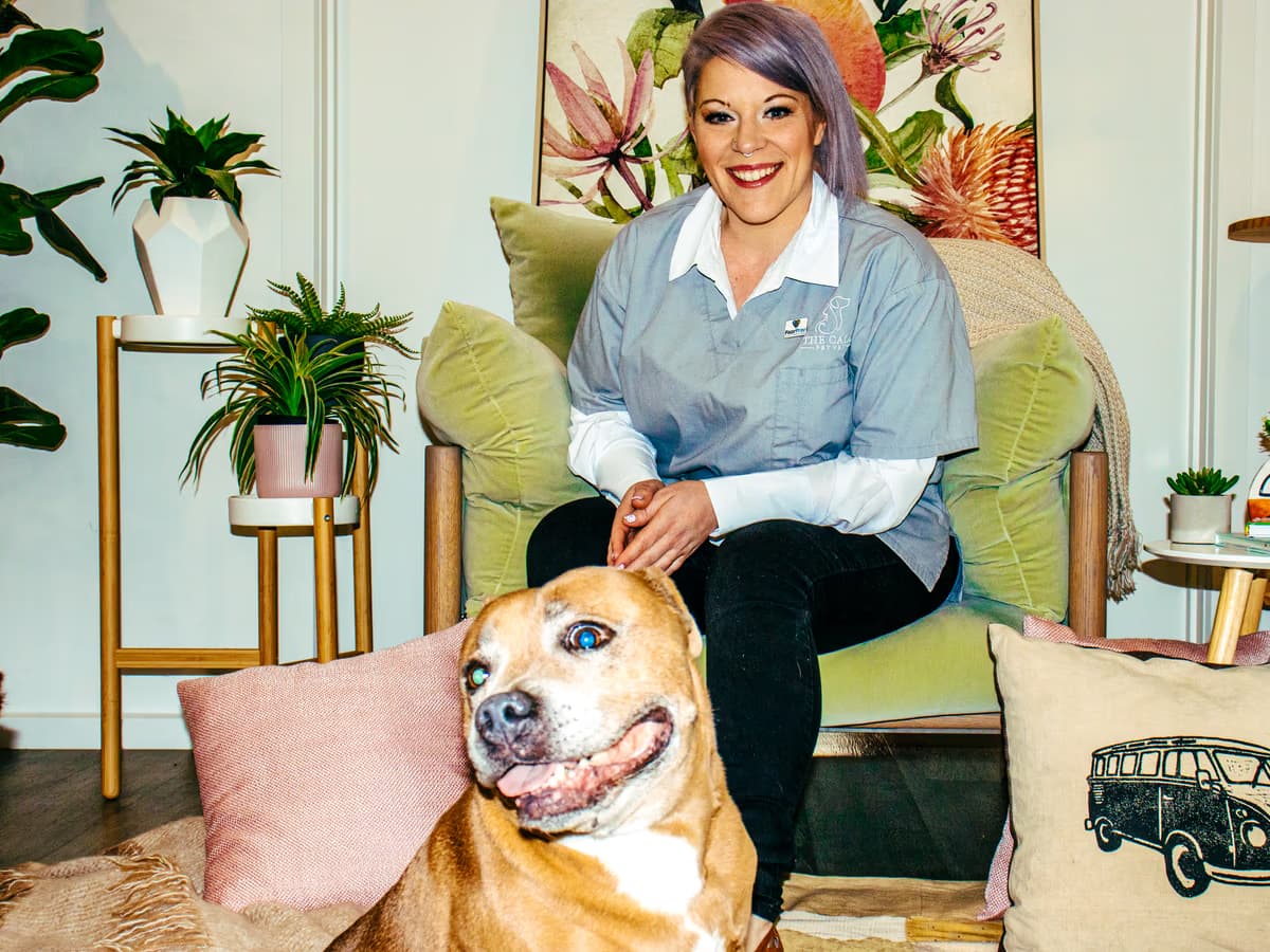 Dr Chantelle McGowan with a relaxed dog during a behaviour consultation